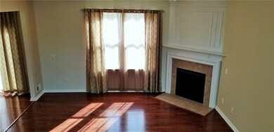 The gas fireplace anchors the great room.