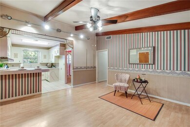 Large hearth room is open to kitchen with breakfas