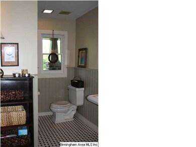 Original bath features tile flooring, a pedestal s