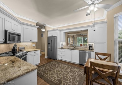 Kitchen featuring dark hardwood / wood-style floor