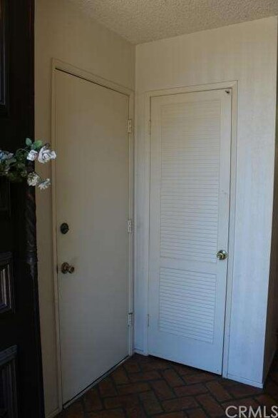 Coat closet, garage access to the left
