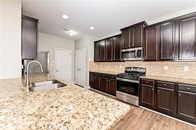 Kitchen featuring appliances with stainless steel 