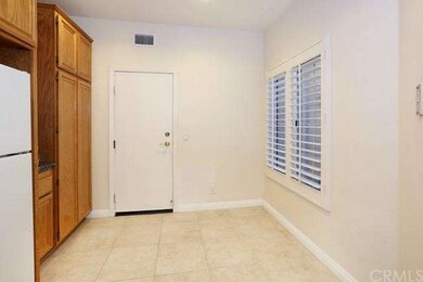 This view of the kitchen shows the eating area and
