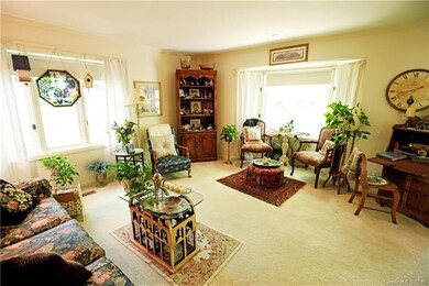Formal living room with bay window