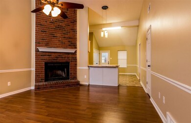 Step into this open concept living room with tall 