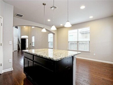 Kitchen with dark wood-style flooring, dark cabin