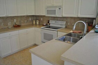 Corian-Tumbled Tile backsplash
