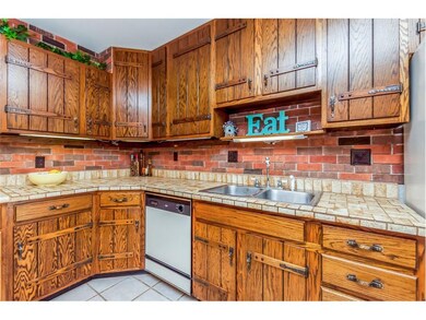 Kitchen with wall of cabinets.