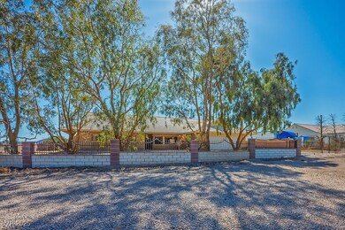 Single story home with a fenced front yard