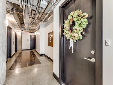 Large elevator vestibule and spacious hallway lead
