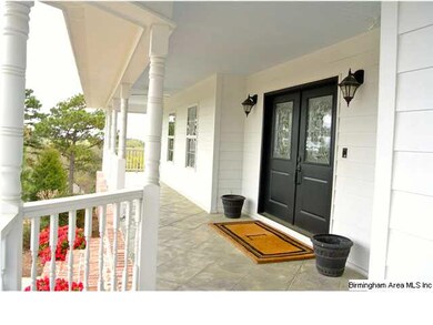 Wrap around stamped concrete front porch with 360 