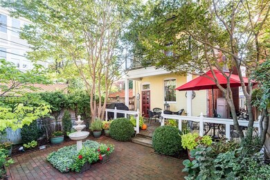 View of the rear gardens, patio & deck