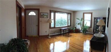 Front door into beautiful hardwood...