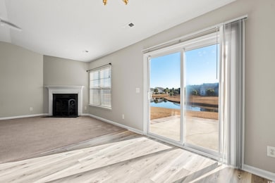 Unfurnished living room featuring light hardwood /