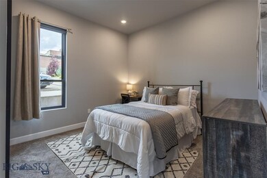 Bedroom with light colored carpet