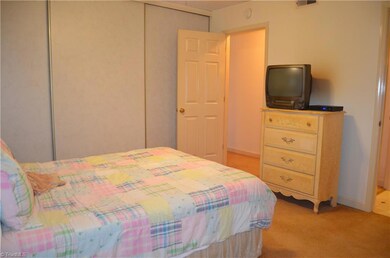 Closet with sliding doors spans entire wall...lots of storage!