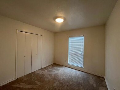 Unfurnished bedroom featuring carpet floors and mu
