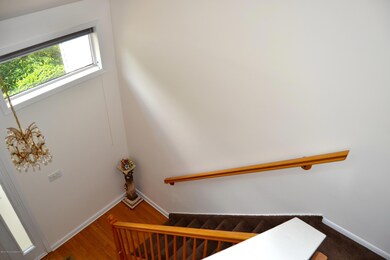 LOOKING DOWN OVER FOYER