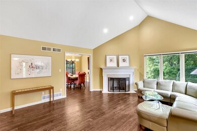 HARDWOOD FLOORS, VAULTED CEILING AND FIREPLACE ARE