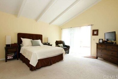 Master bedroom with vaulted ceilings.