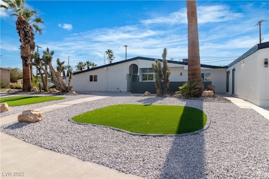 Ranch-style home featuring stucco siding and a fro