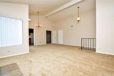 Living room, next to the fireplace; front door ent