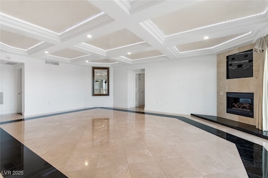 Unfurnished living room with inlaid floor details,