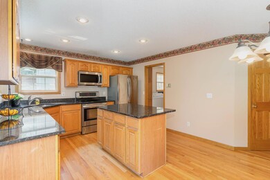 Kitchen checks all the boxes: Granite, SS appliances, window views and a center island