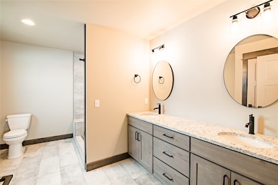 Bathroom featuring light tile patterned flooring, recessed lighting, and a shower