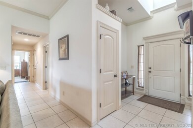 Bright, 2-Story entry welcomes guests with tile fl