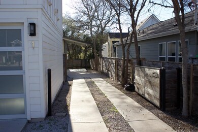 View of side of home with fence