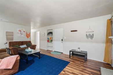 Living room featuring wood finished floors