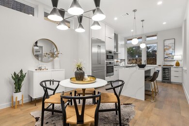 Dining room featuring beverage cooler, light wood