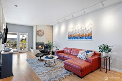 The living room is spacious and comfortable, beckoning you to views of the Tacoma Narrows.