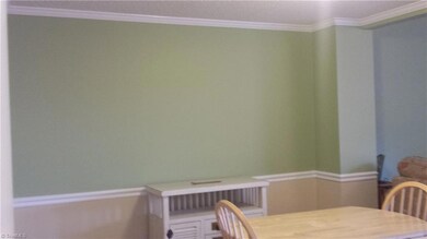 Freshly painted wainscoting in dining room.