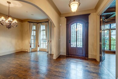 Entry Hall, dining room is on the left and the library is on the right
