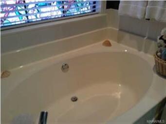 Garden tub with a separate shower.