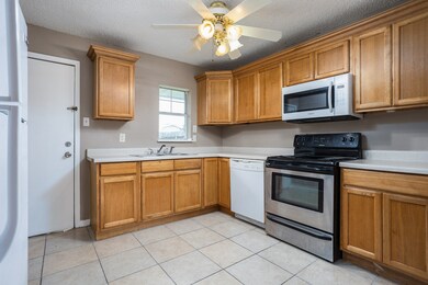 Kitchen has plenty of Cabinet Storage and the Refrigerator stays.