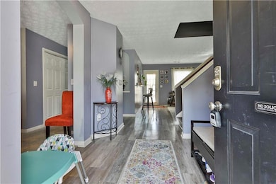 Foyer featuring hardwood / wood-style flooring and