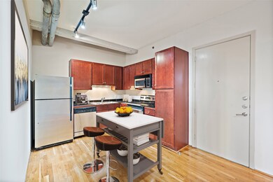 Virtually staged view of the kitchen area with sta