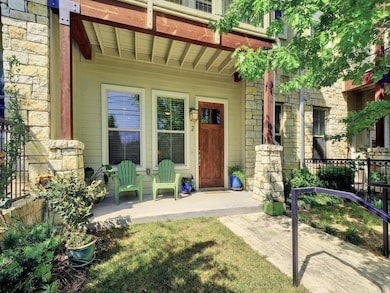 View of exterior entry with a porch and stone sid