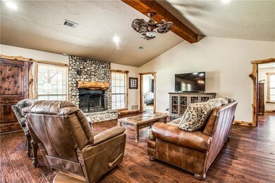 Spacious living room with rock wood burning firepl