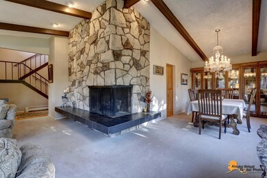 Wrap-around rock fireplace with fossils