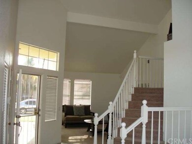 Front entryway with the living room and stairway o