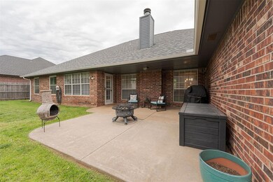 View of patio / terrace featuring an outdoor fire 