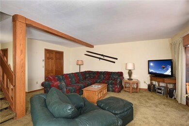 Great room with fireplace that opens to sun room a