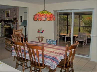 Dining Room/Family Room Combo with Sliders to Flor