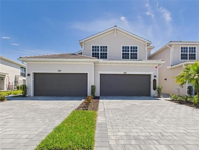 View of front facade featuring driveway and an att
