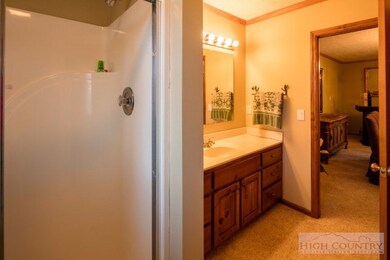 Upstairs Bath: Upstairs bath not only opens into t