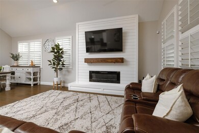 Living room featuring dark wood-type flooring, lof